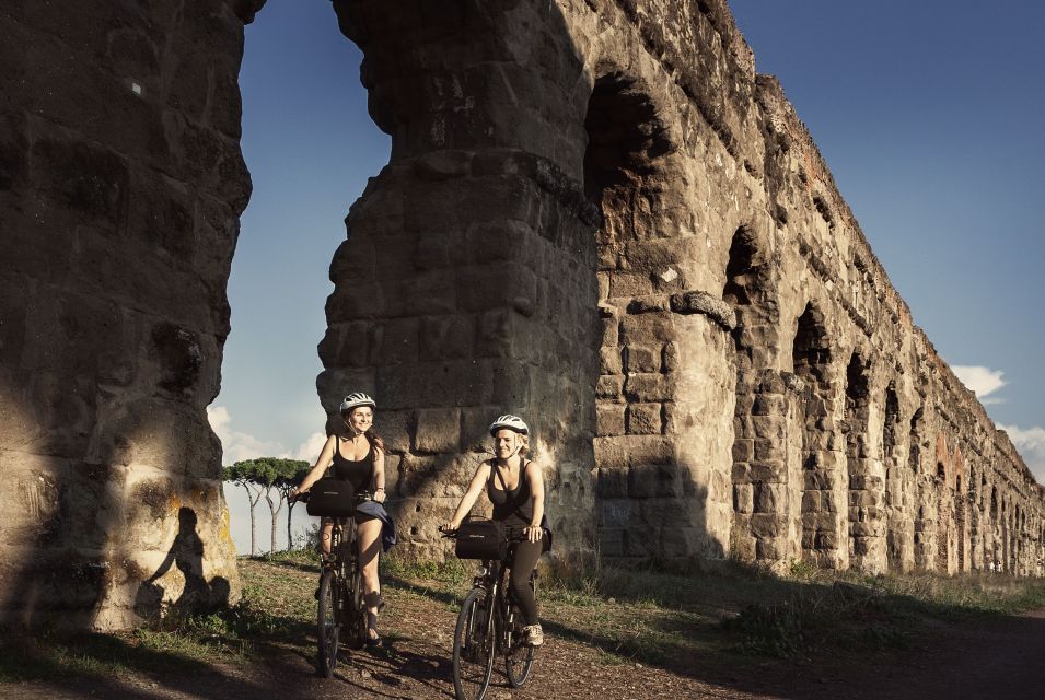 Rome: Appian Way & Roman Aqueducts Guided E-Bike Tour - City warmup stops: walls, tomb culture, and the start of the story