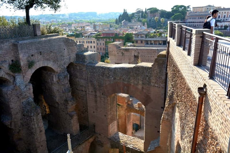 Rome: Colosseum & Roman Forum Guided Tour - Inside the Colosseum: gladiators, crowd votes, and backstage machinery
